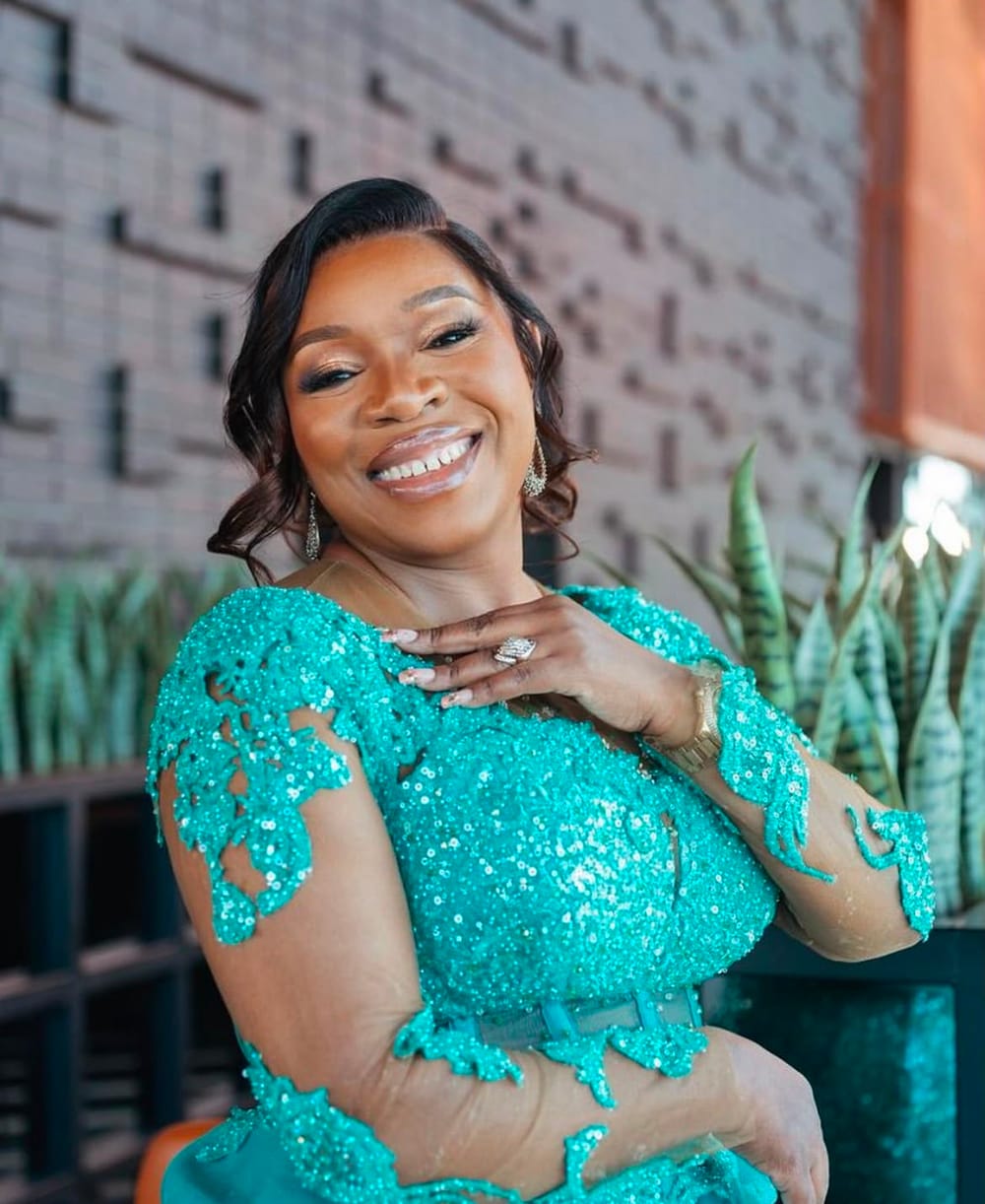 Event portrait with glam makeup in a teal sequin dress